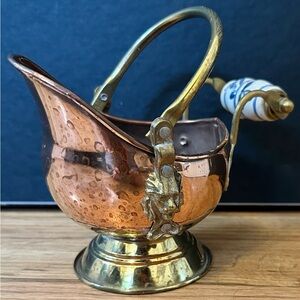 Red Copper and Brass Decorative, with Lyons head decoration and porcelain handle